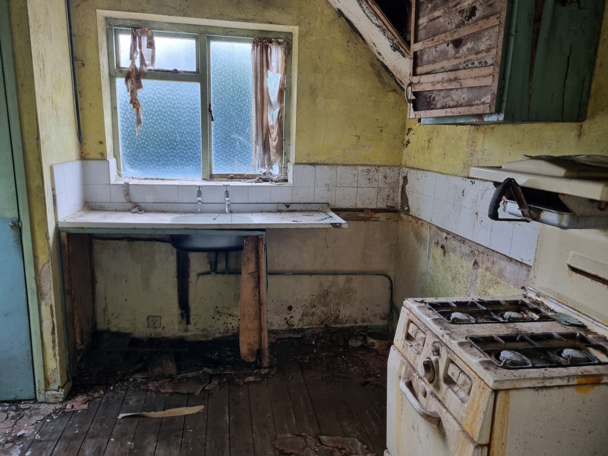 The kitchen before we started - dated units and no usable worktop